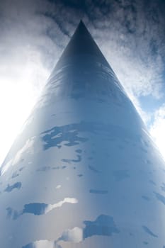 The Spire of Dublin with reflection of clouds and sky