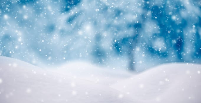 Snowy background with closeup view of the wavy snowdrifts in snowfall. Concept of the wallpaper, background and backdrop.