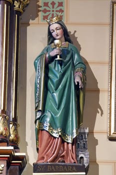 Saint Barbara, statue on the altar of Saint Anthony of Padua in the parish church of the Annunciation of the Virgin Mary in Velika Gorica, Croatia