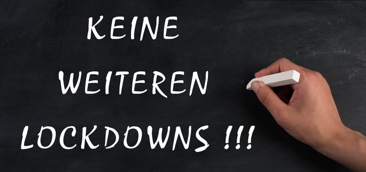 No more lockdowns is standing on a chalkboard, german language, pandimic covid-19 end, anti restrictions