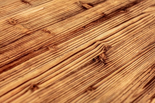 Detail on wooden boards, grain of wood  enhanced by burning.