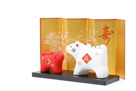 Dolls of Tora Tiger. Japanese new year card. Japanese new year tiger object. Japanese word of this photography means "fortune, congraturations"""