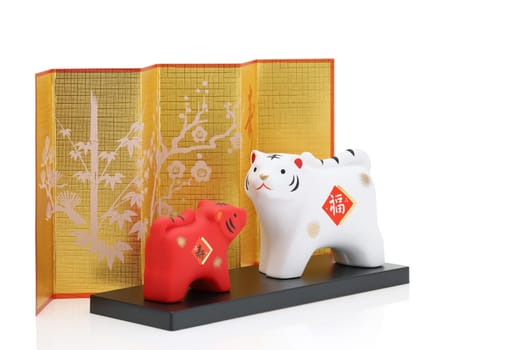 Dolls of Tora Tiger. Japanese new year card. Japanese new year tiger object. Japanese word of this photography means "fortune, congraturations"""