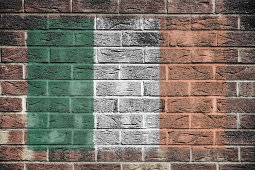 An Ireland flag painted on brick wall background