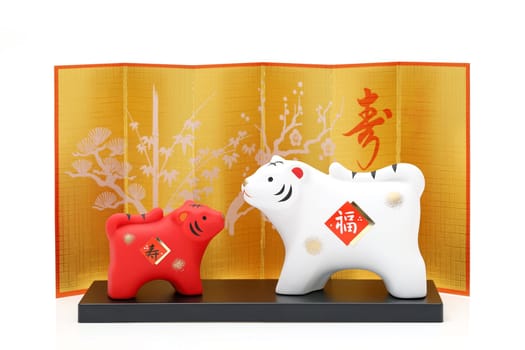 Dolls of Tora Tiger. Japanese new year card. Japanese new year tiger object. Japanese word of this photography means "fortune, congraturations"""