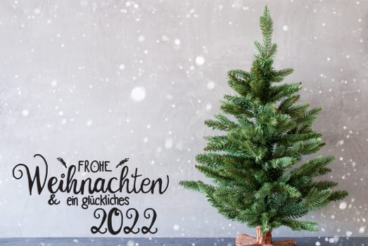 German Calligraphy Frohe Weihnachten Und Ein Glueckliches 2022 Mean Merry Christmas And A Happy 2022. Green Christmas Tree With Gray Concrete Background