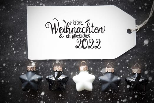 Label With German Calligraphy Frohe Weihnachten Und Ein Glueckliches 2022 Means Merry Christmas And A Happy 2022. Black Christmas Ball Ornament With Snowflakes
