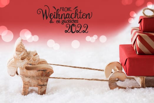 Reindeer With Sled And Christmas Gifts And Snow. Red Sparkling Background With German Calligraphy Frohe Weihnachten Und Ein Glueckliches 2020 Means Merry Christmas And A Happy 2020
