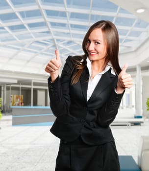 Smiling business woman in corporate building
