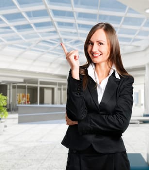Smiling business woman in corporate building