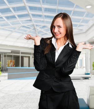 Smiling business woman in corporate building