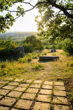 Sculpture park st. margarethen rocks with sunrays at sunset
