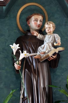 Saint Anthony holds the baby Jesus, the main altar in the church of Saint Anthony of Padua in Bjelovar, Croatia