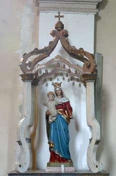 Virgin Mary with child Jesus, statue in the church of Our Lady of the Snows in Volavje, Croatia