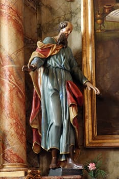 Statue of Saint on the main altar in the Church of St. John the Apostle and Evangelist in Cerje, Croatia