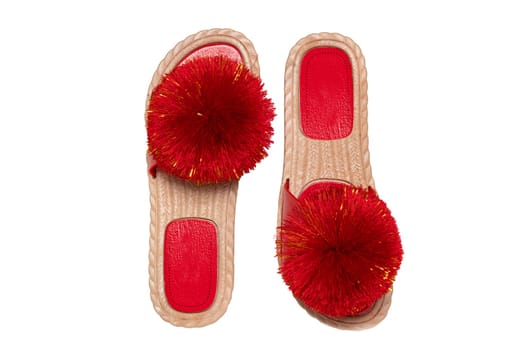 Womens boots and shoes. Top view of a pair women slipper with red pompoms isolated on a white background. Fashion of sandals.