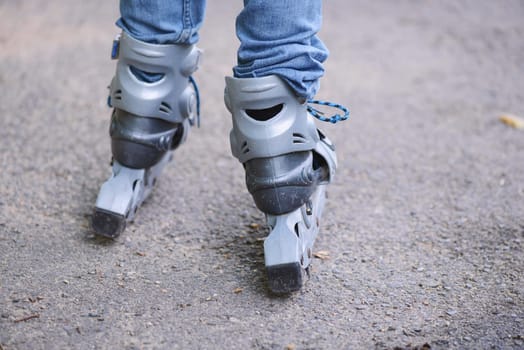 Inline Skating child, learning a new sport activity, outdoor, summertime
