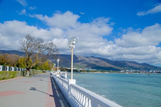 The embankment of the resort gelendzhik, you can see the asphalt path, lanterns, fencing and the sea. High quality photo