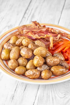 Golden potatoes, smoky bacon, and roasted peppers create a savory, flavorful dish