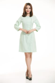 Staff wear coats in front of white background