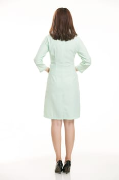 Staff wear coats in front of white background