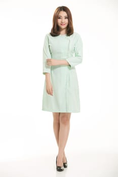 Staff wear coats in front of white background