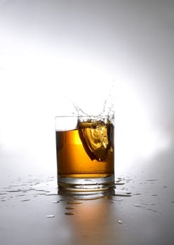 Splashing glass of whiskey