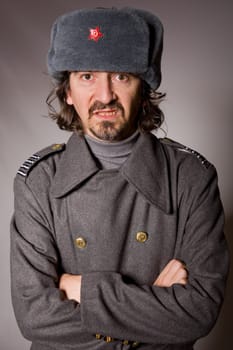 young man dressed as russian military, studio picture