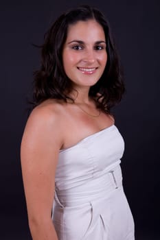 young beautiful brunette portrait against black background