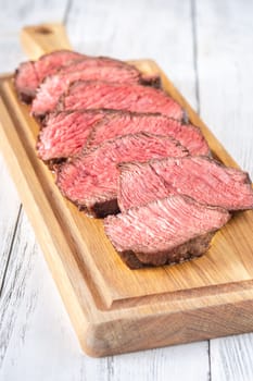 Tender fillet mignon steak, perfectly cooked, sliced, and elegantly presented 