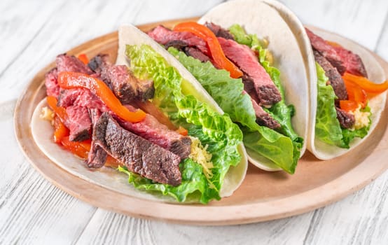  Flavorful carne asada tacos with tender steak, fresh toppings, and melted cheese