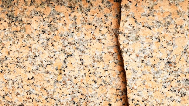 Real natural brown granite pattern, polished mineral slice. Seamless cracked marble damaged concrete texture. Architectural background. Brown spots on a stone background. marbling.