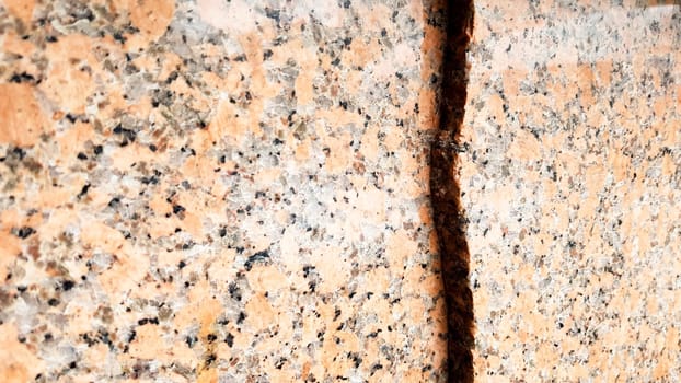 Real natural brown granite pattern, polished mineral slice. Seamless cracked marble damaged concrete texture. Architectural background. Brown spots on a stone background. marbling.