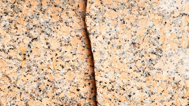 Real natural brown granite pattern, polished mineral slice. Seamless cracked marble damaged concrete texture. Architectural background. Brown spots on a stone background. marbling.