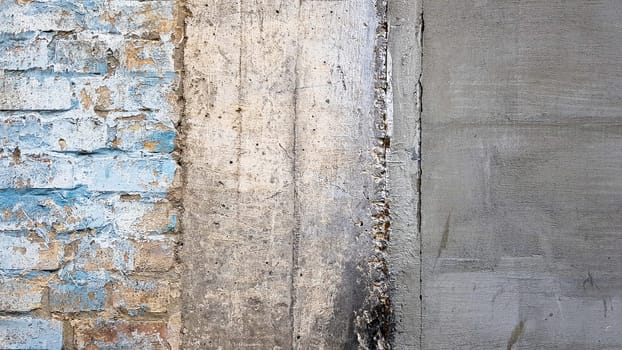Empty old brick wall texture. Painted problem wall surface. Grunge wide brick wall. Grunge red stone wall background. Shabby building facade with damaged stucco. Copy space