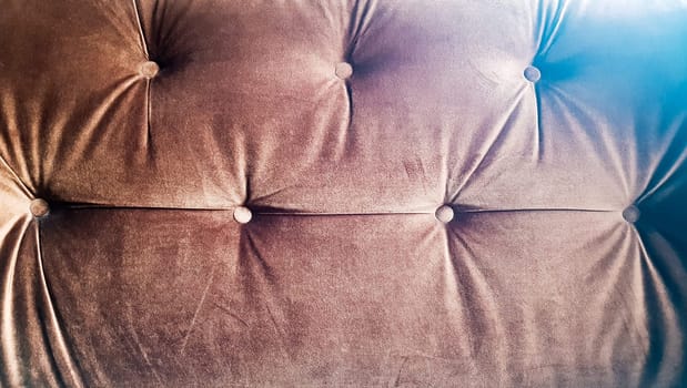 Brown capitone texture background, Chesterfield retro style diamond-shaped soft tufted fabric decoration with buttons, decorate with buttons, close up