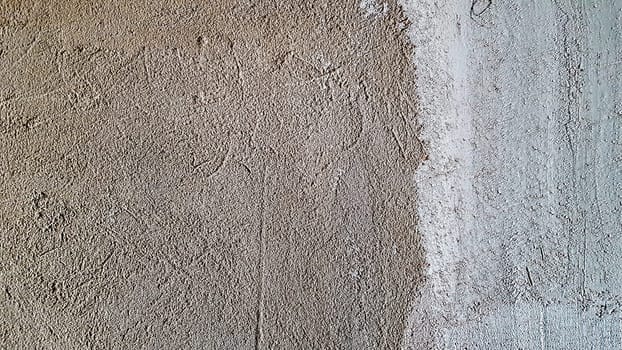 Vintage interior of a gray cement wall. Plaster texture. Grungy gray textured background in a rustic style. Concrete plaster. Pattern Details Empty Blank Space Copy Macro Closeup.