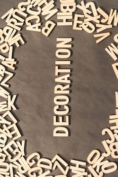 Decoration Word In Wooden Cube Alphabet Letters Top View On A rustic paper Background.