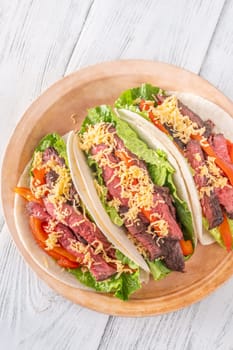  Flavorful carne asada tacos with tender steak, fresh toppings, and melted cheese