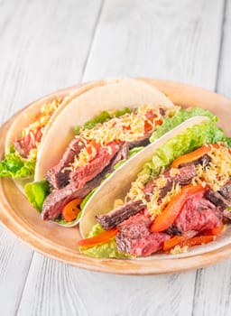  Flavorful carne asada tacos with tender steak, fresh toppings, and melted cheese