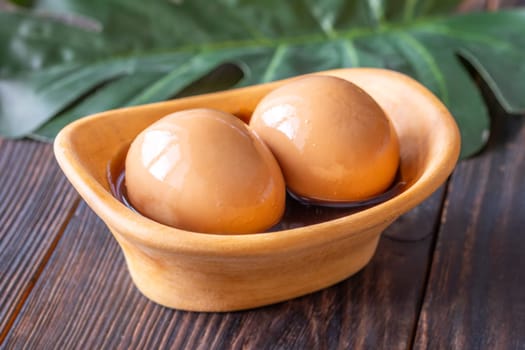 Soft-boiled ramen eggs soaked in savory marinade, garnished with sesame seeds