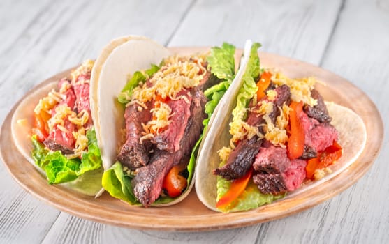  Flavorful carne asada tacos with tender steak, fresh toppings, and melted cheese