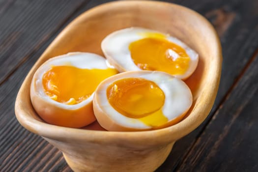 Soft-boiled marinated ramen eggs, halved to reveal rich, golden yolks