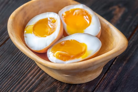 Soft-boiled marinated ramen eggs, halved to reveal rich, golden yolks