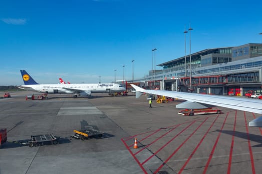 Hamburg, Germany - March 20, 2014: Lufthansa aircraft at new Terminal in Hamburg ready for boarding.