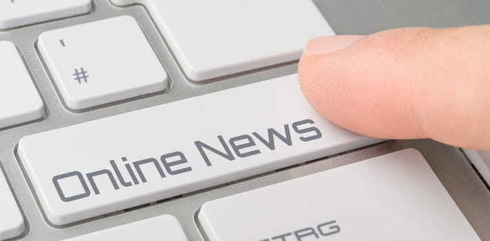 A keyboard with a labeled button - Online News