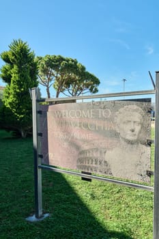 Civitavecchia, Italy - February 02, 2025: A rustic sign welcoming visitors to the port of Rome, showing signs of wear and age. Concept: entrance, tourism, decay