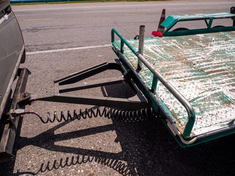 Open car trailer. Shop selling Open car trailer. on the road