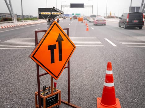 The signs repairs road and worker on the road
