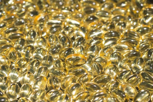 Background of scattered fish oil omega 3 6 9 pills